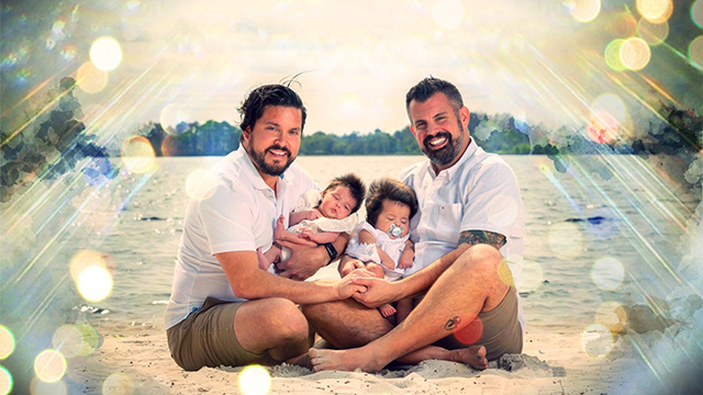 Two dads with their daughters